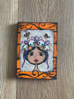 Corona de Calaveras Plaque